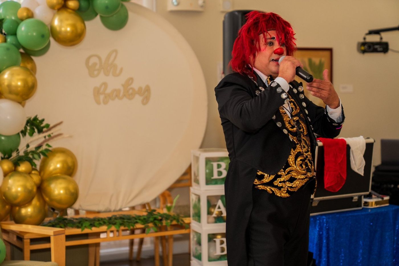 A costumed performer singing into a microphone at the celebration