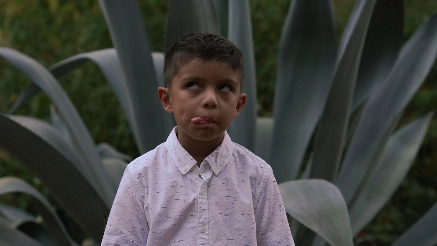 Son making a playful face for the camera