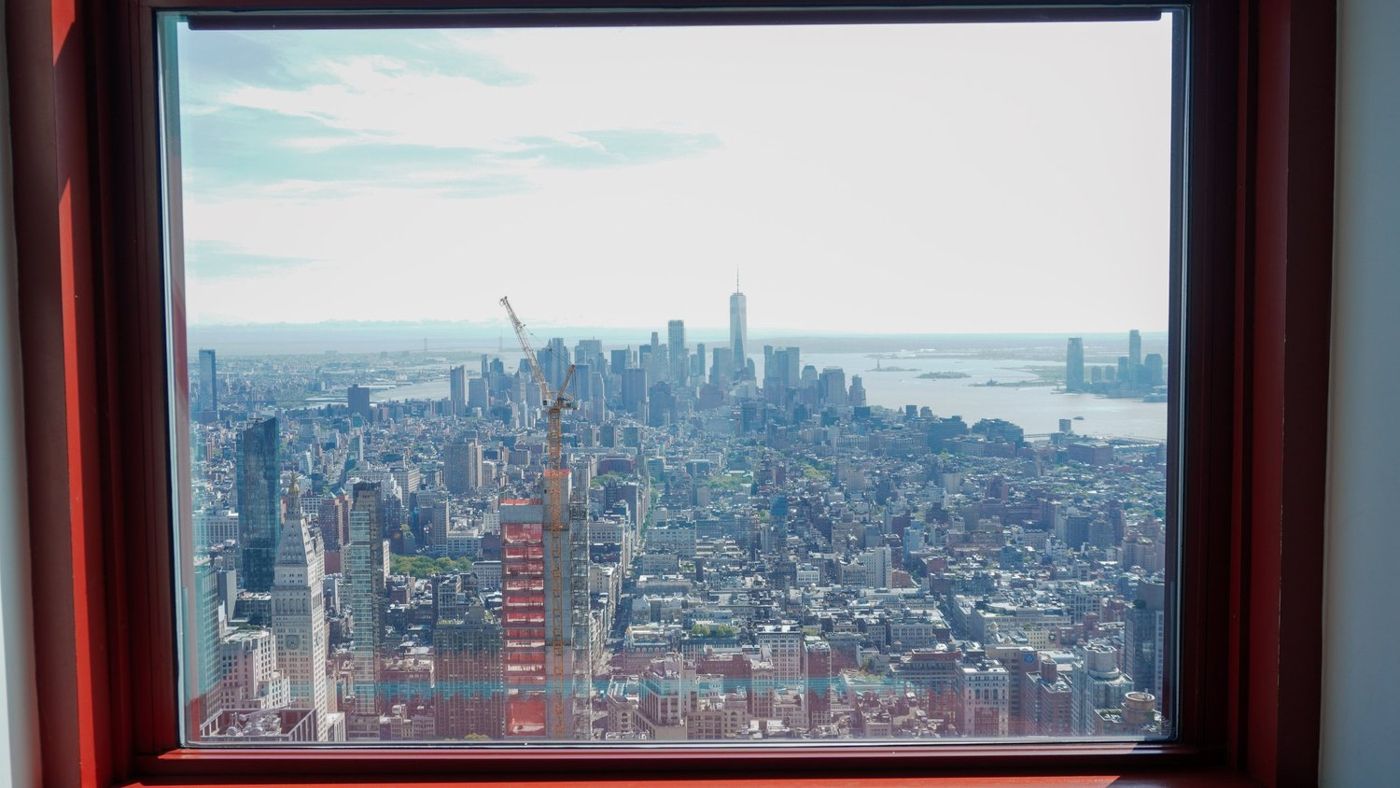 City skyline framed through a window