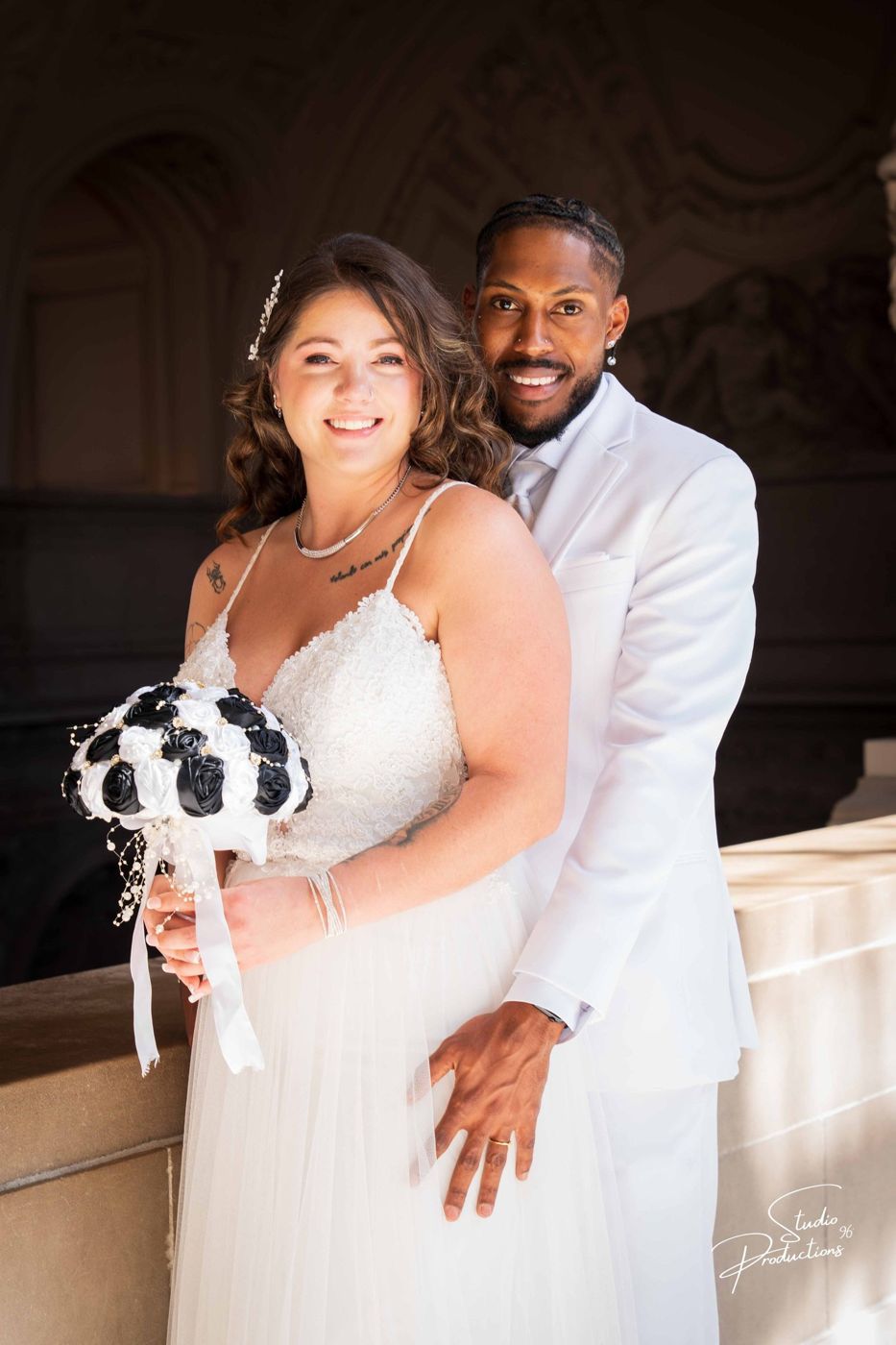 A candid moment of the bride laughing with the groom