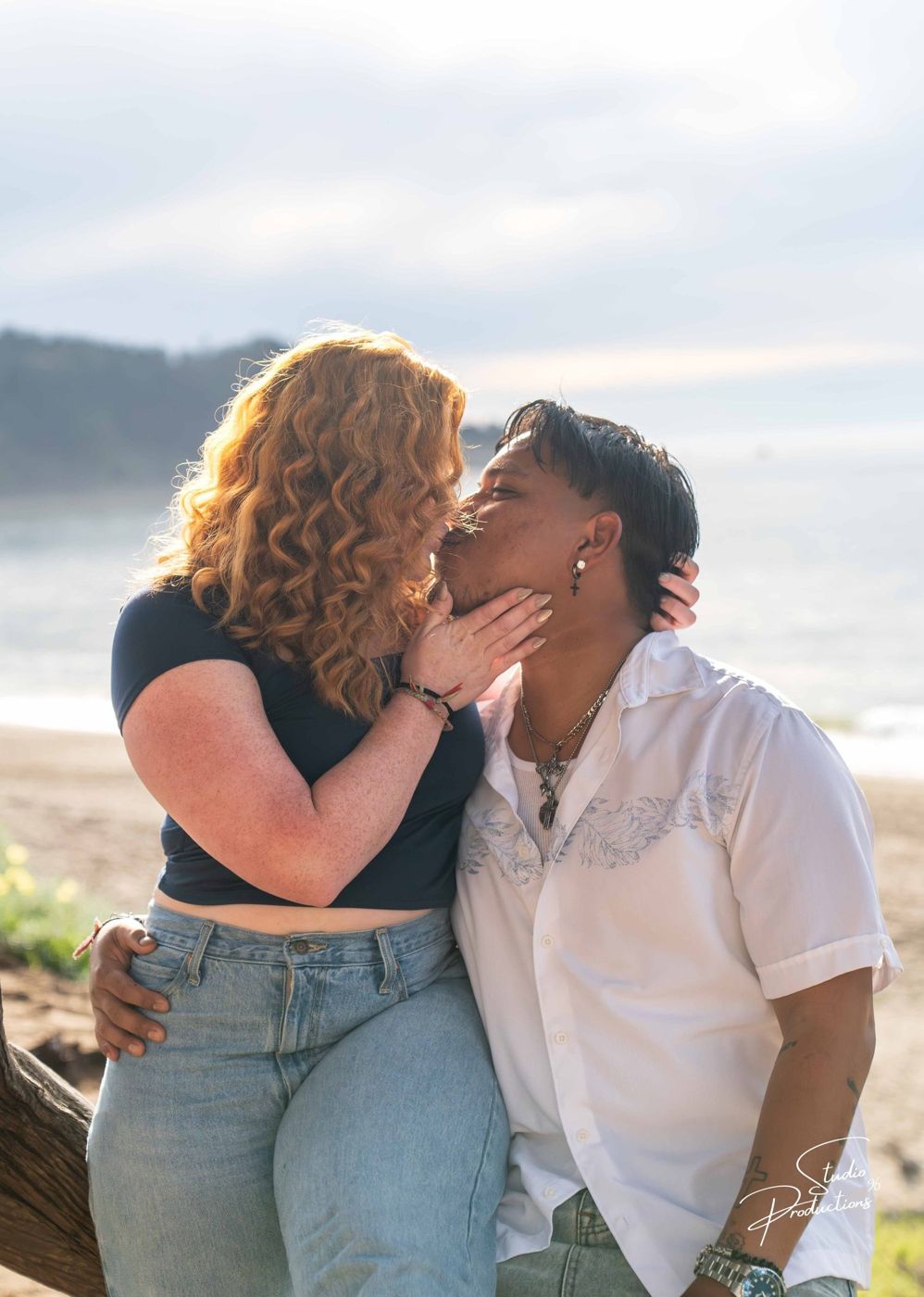 Close-up kiss on the beach at golden hour