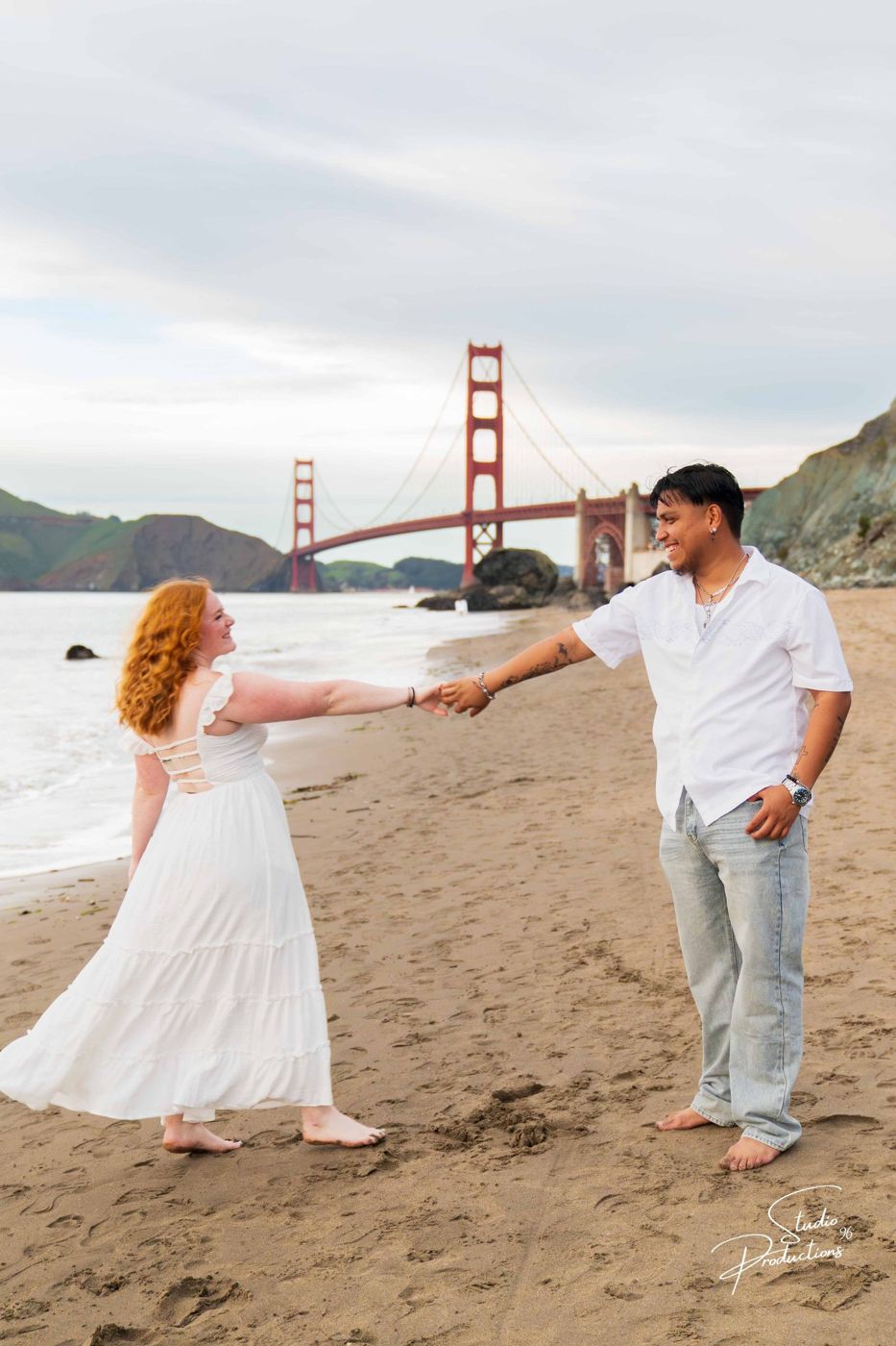Candid laughing moment walking along the sand